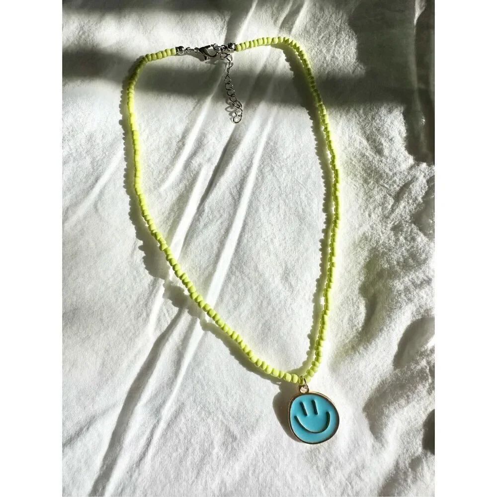 Blue and yellow beaded beach necklace with smiley face charm